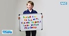 Child holding noticeboard showing message promoting flu jab to pregnant women