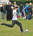 Girl playing football about to strike