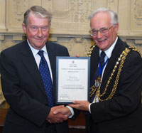 Nigel Gray accepting award from Mayor Cllr Roger Newstead