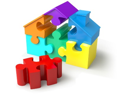 An image of some puzzle pieces making up a house
