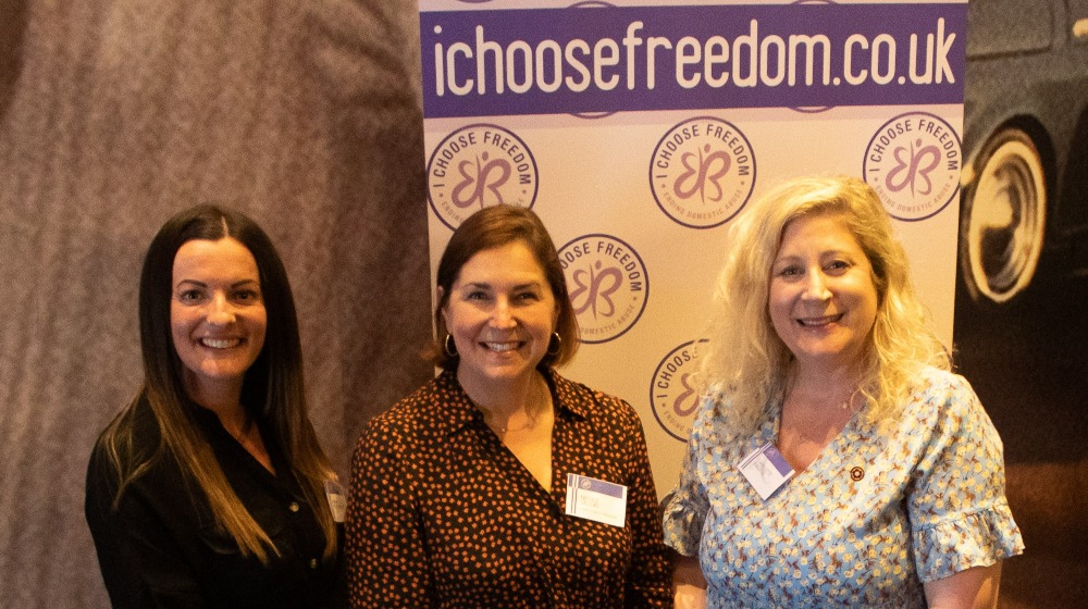Image of Emma Armstrong (left) and Charlotte Kneer MBE DL (right) from I Choose Freedom with the National Domestic Abuse Commissioner Nicole Jacobs (centre)