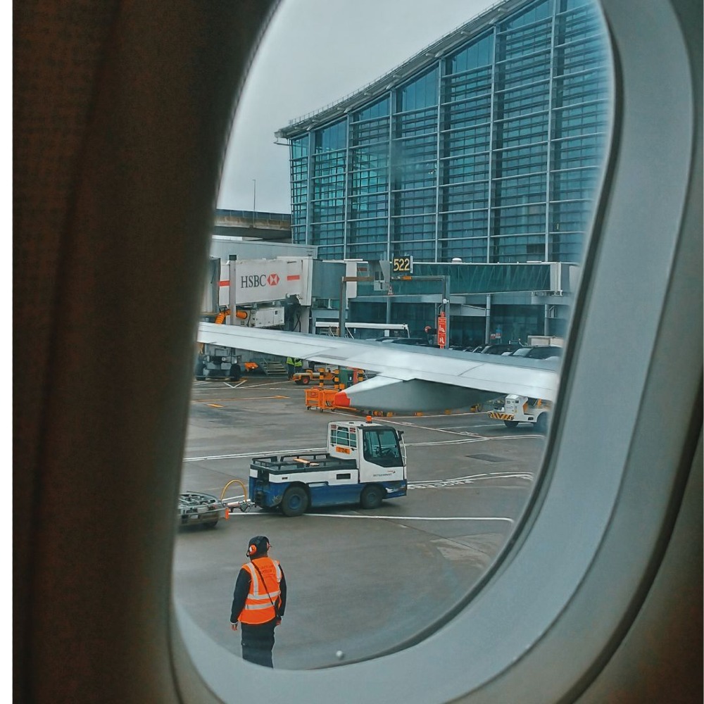 Picture of an airport through a plane window