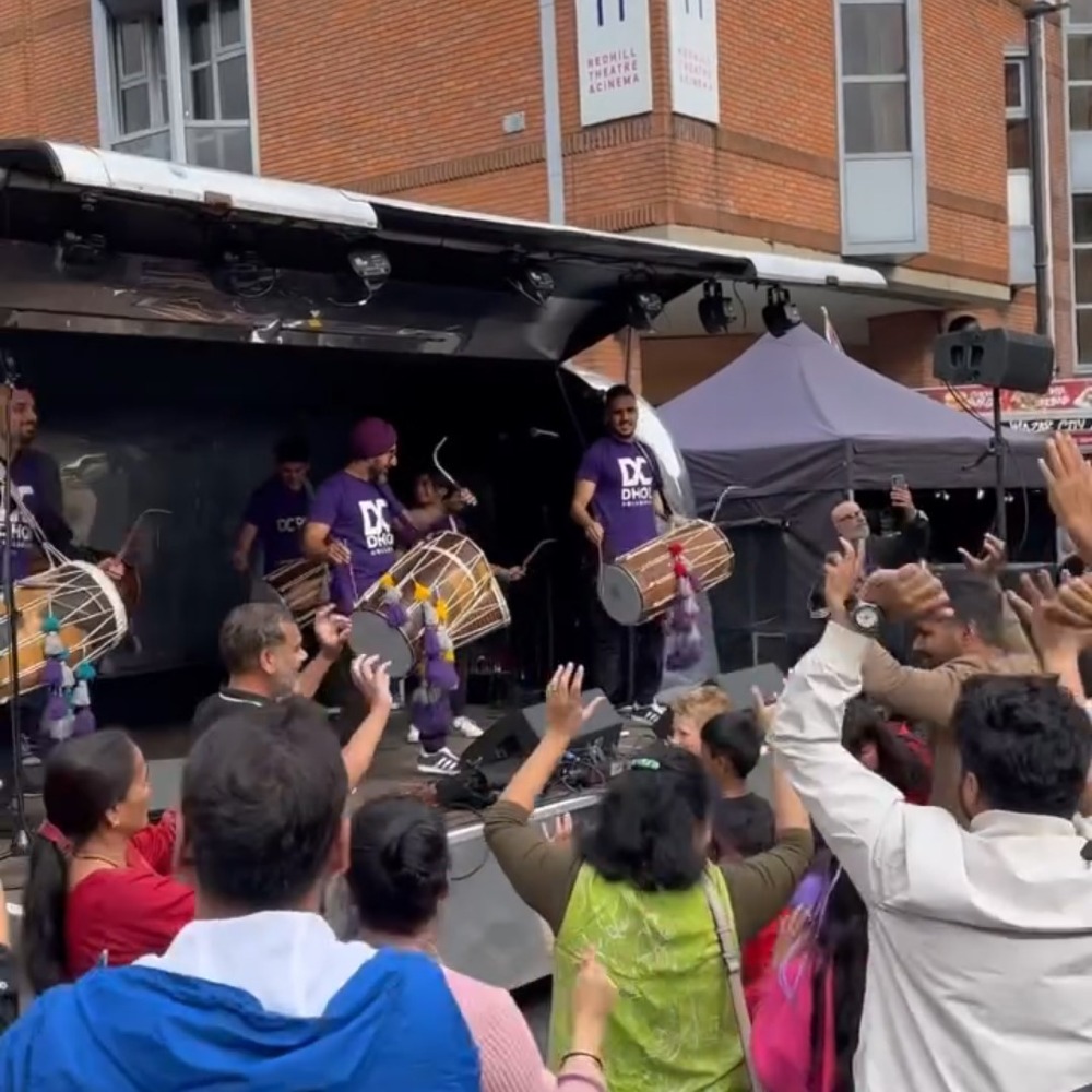 Crowd dancing the the drumming band