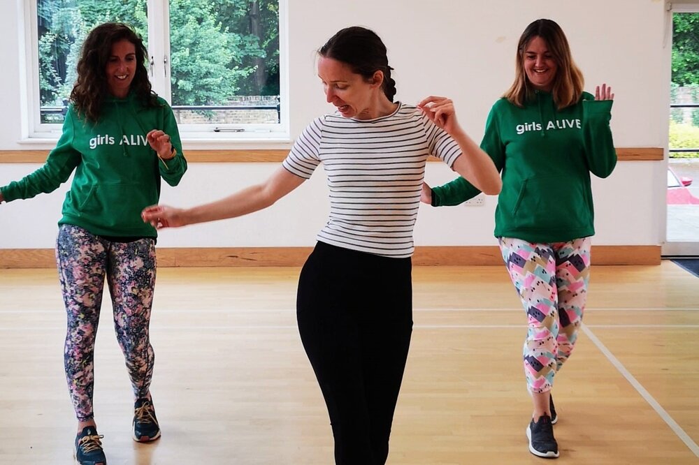 Anastasiia holding a dance class supported by charity, girls ALIVE