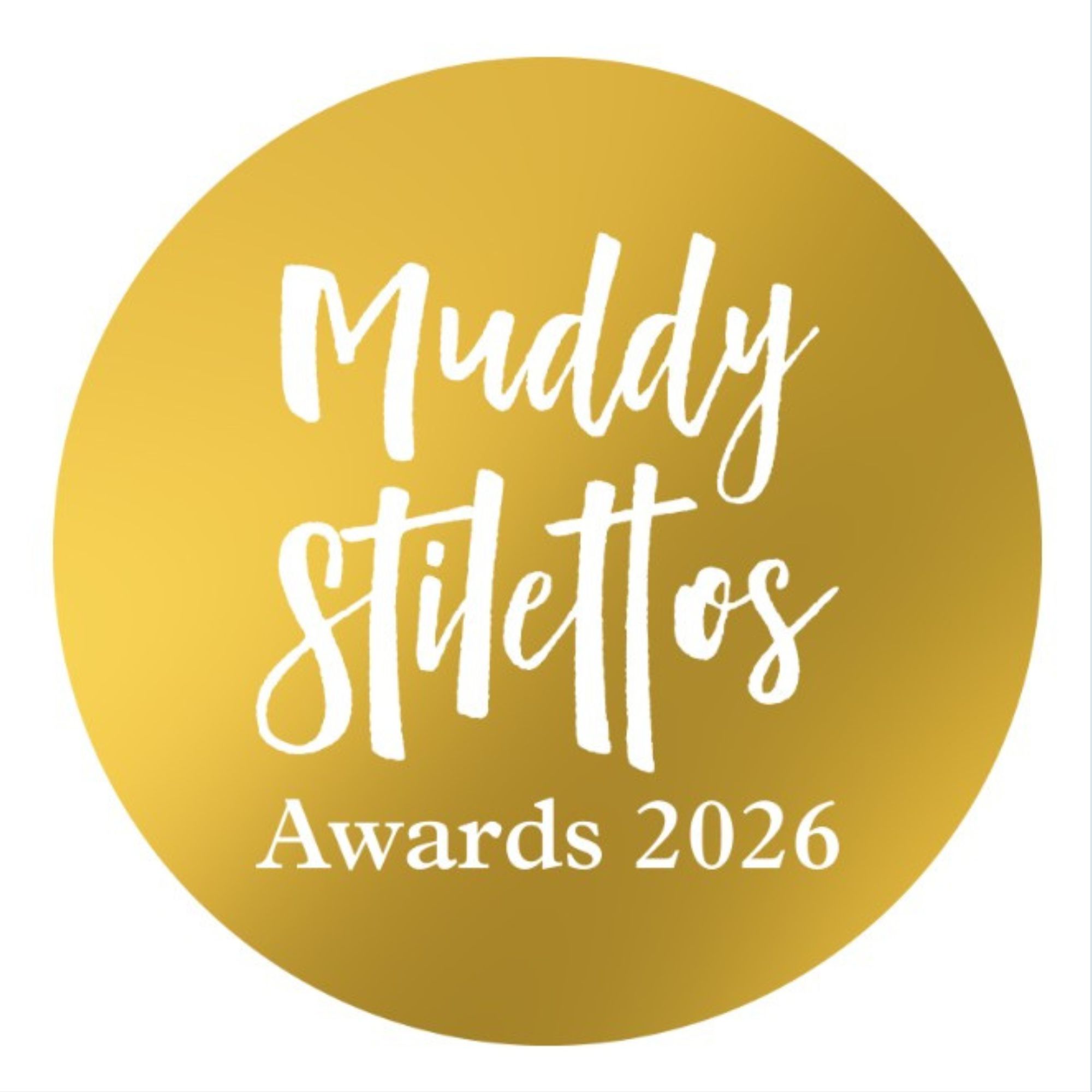 Gold circular badge with white handwritten-style text reading “Muddy Stilettos Awards 2026.”