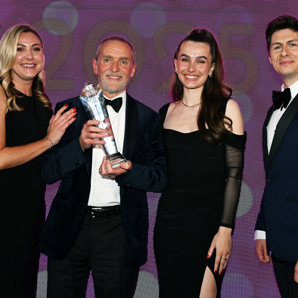 Photo of group of people in evening dress and glass awards