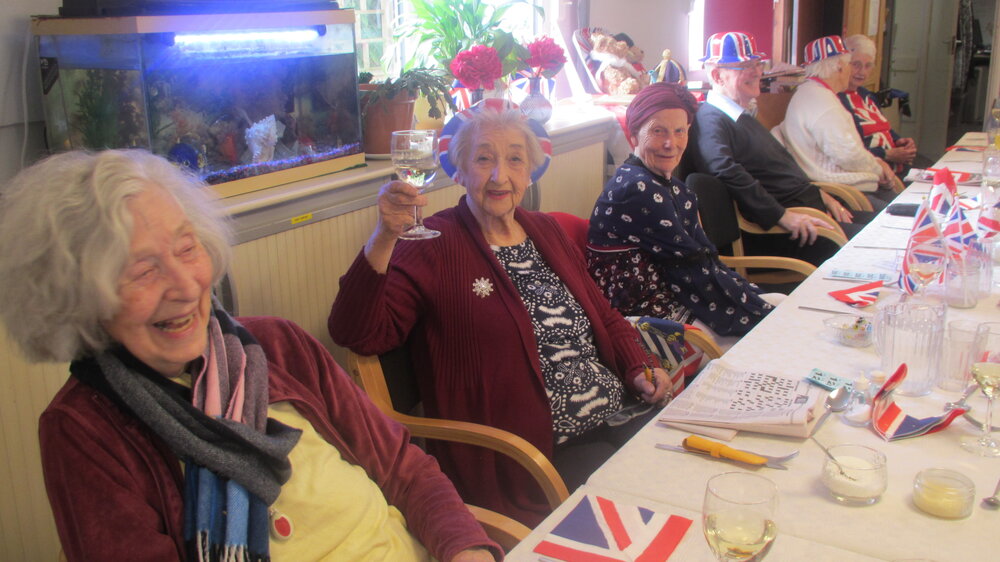 Photograph of older people enjoying an Age Concern Merstham, Redhill and Reigate social event