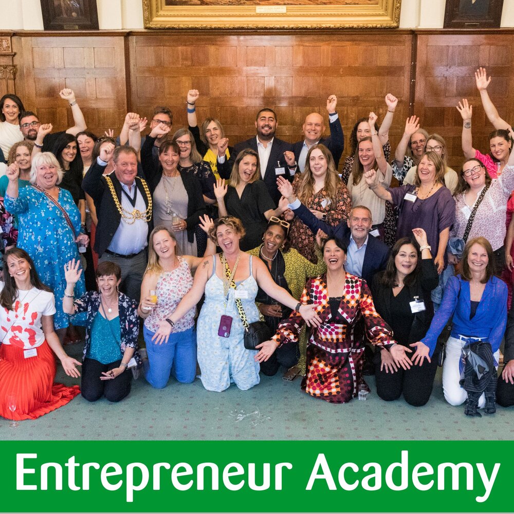 Group of people punching the air and smiling