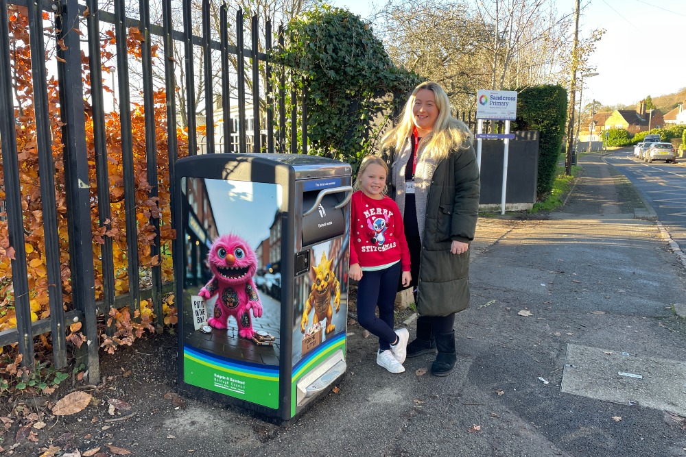 Cllr Hannah Avery, Executive Member for Neighbourhood Services, with Adelaide, one of the voices behind the talking bins, at Sandcross School