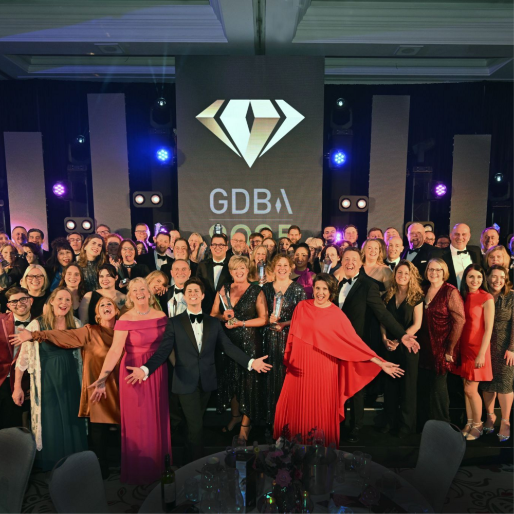 Group of people wearing evening dress, some carrying awards