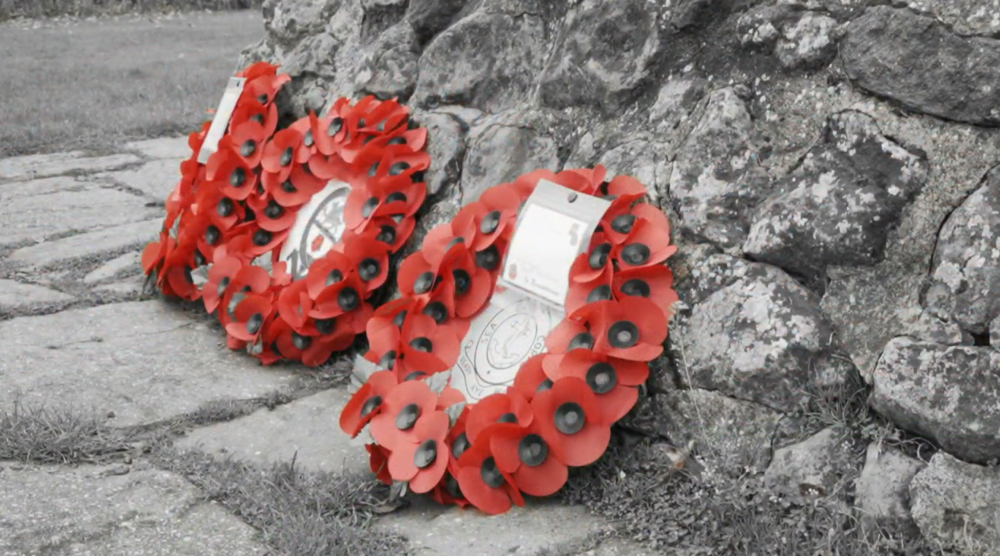 Poppy wreaths at a memorial